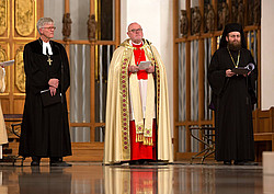 Kardinal Reinhard Marx, EKD-Vorsitzender Heinrich Bedford-Strohm und Bischof Sofian von Kronstadt, Weihbischof der Rumänischen Orthodoxen Erzdiözese von Deutschland im Jahre 2014 bei einem Festgottesdienst im Münchner Liebfrauendom (Archivbild von 2014)